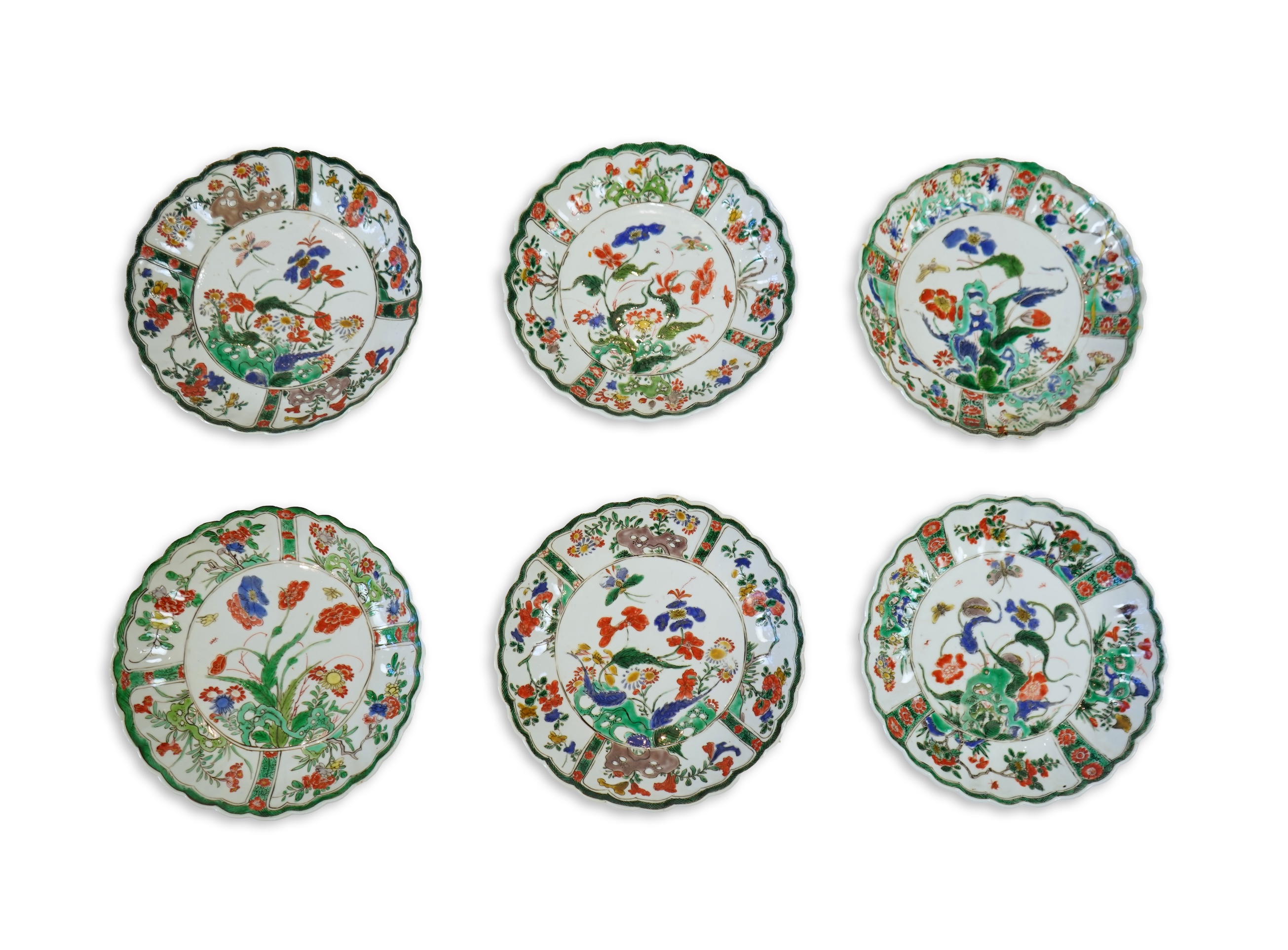 A set of six Chinese famille verte petal lobed saucer dishes, Kangxi period